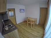 common room / kitchen in apartment